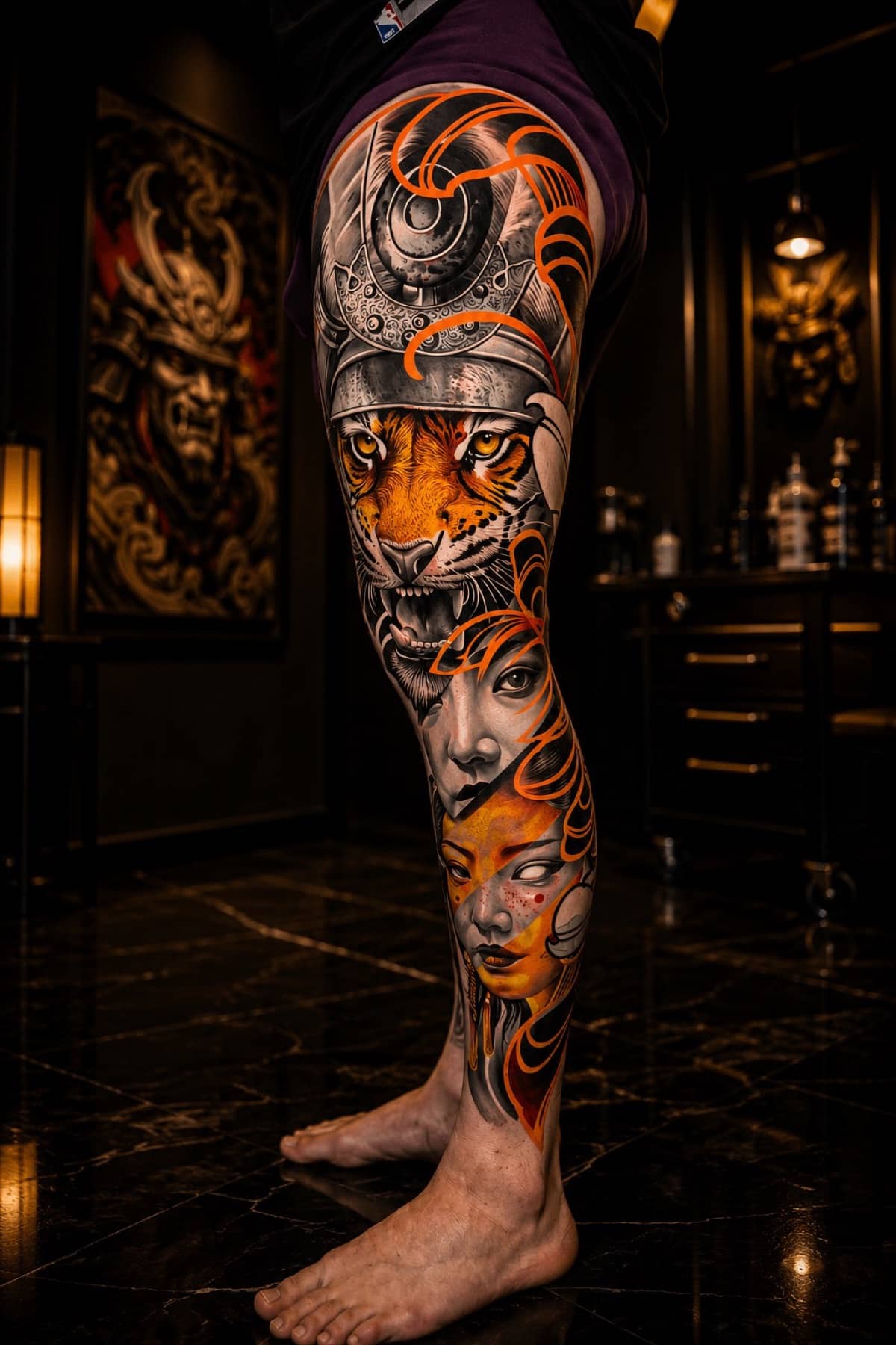 Japanese colour leg sleeve with samurai helmet, tiger, and orange cloud swirls at Bloodline Tattoo Bangkok
